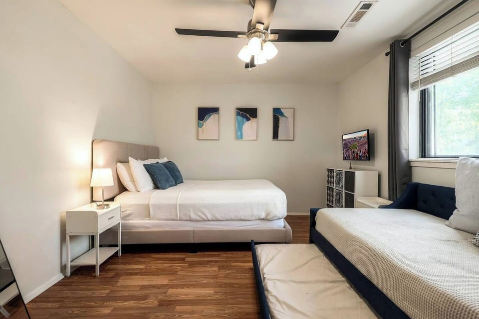 Guest bedroom featuring queen bed and twin daybed with trundle.