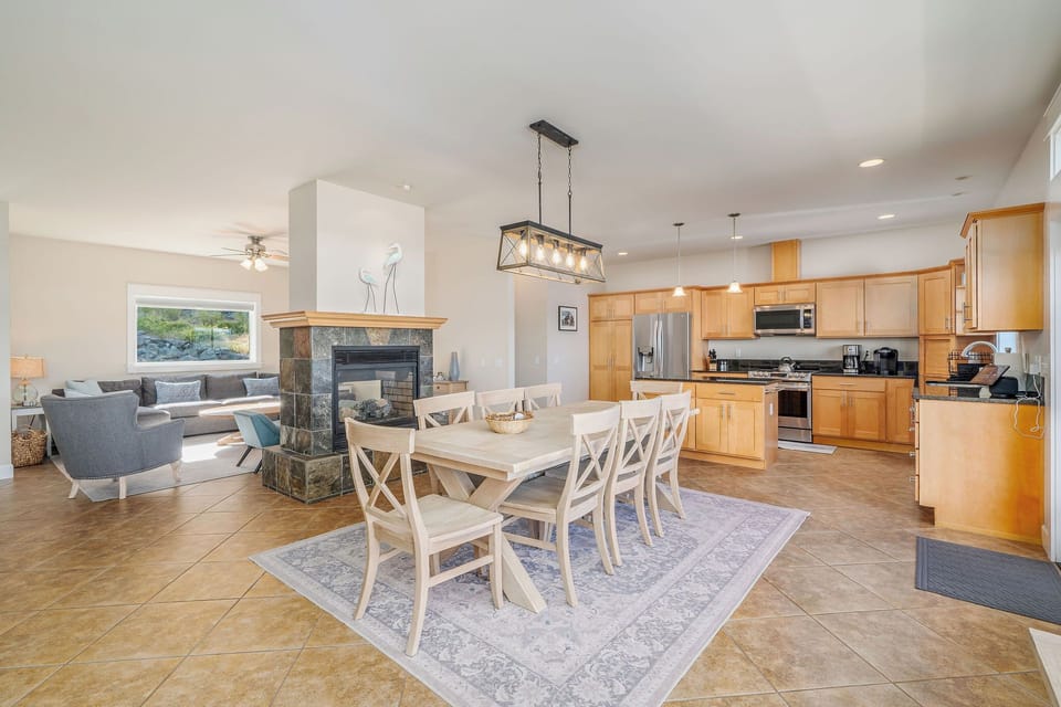 Open concept living, dining and kitchen with fireplace.