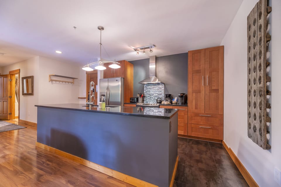 Gourmet kitchen with solid granite counters and stainless steel appliances