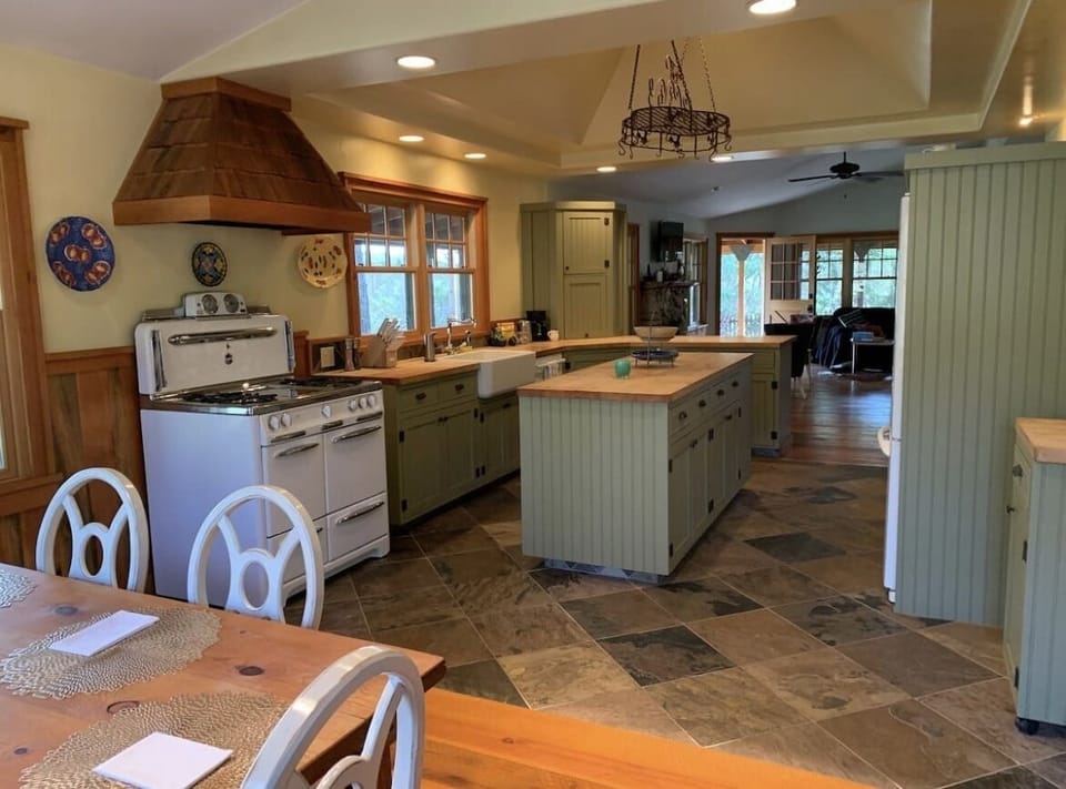 View of kitchen and living room from dining area