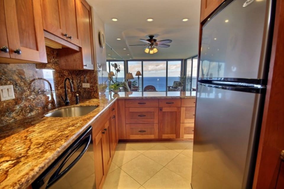 Full sized appliances, cherry wood cabinets and granite top counters
