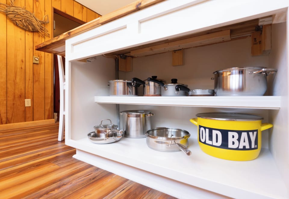 Your fully-equipped kitchen features quality stainless steel cookware and charming touches that make cooking feel like home.