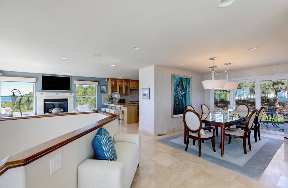 Another view of the open living area. Living areas open to kitchen and formal dining room.