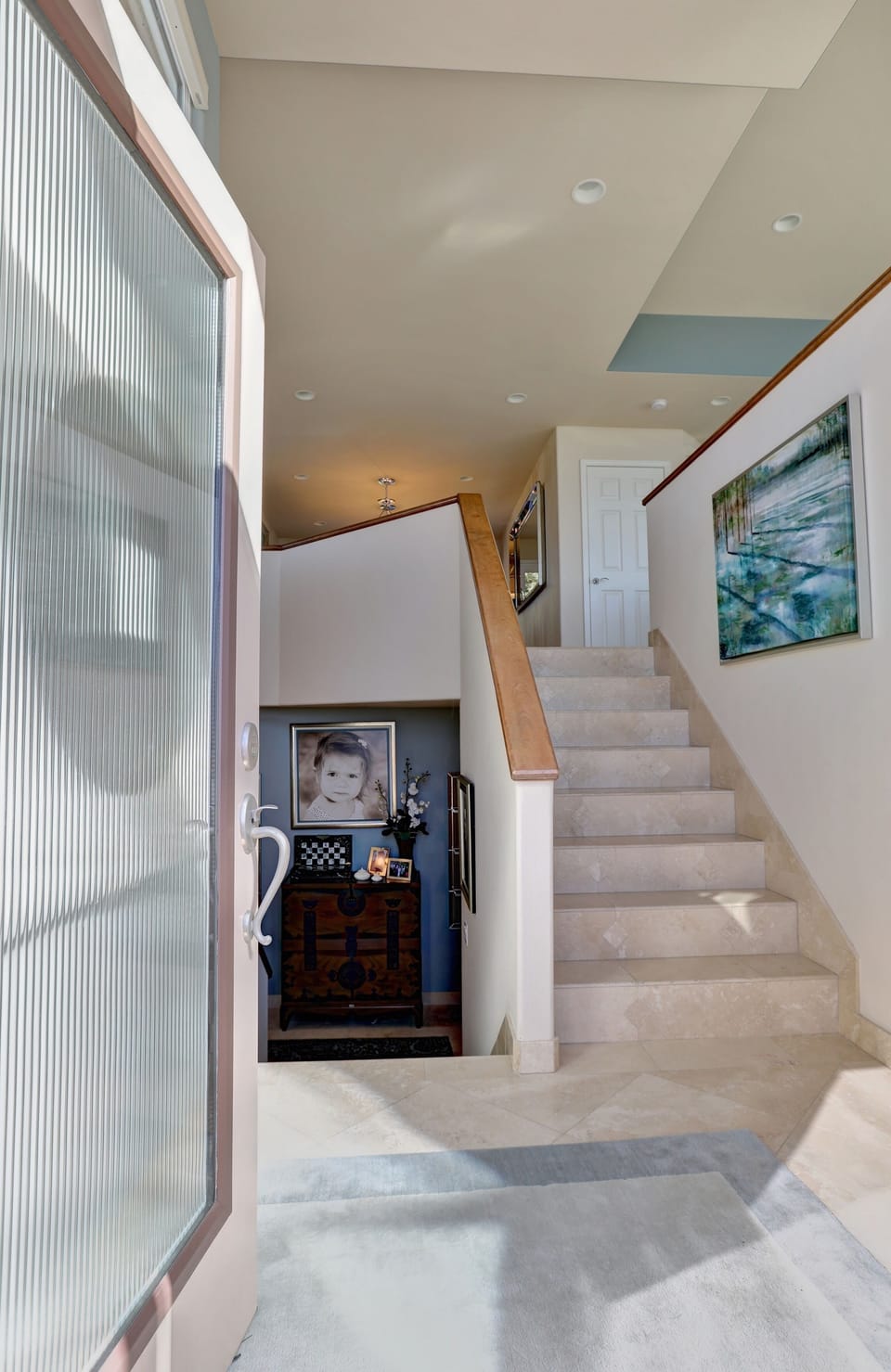 Split level entry. At first level is the guest bedroom with ensuite bathroom, office and garage access.