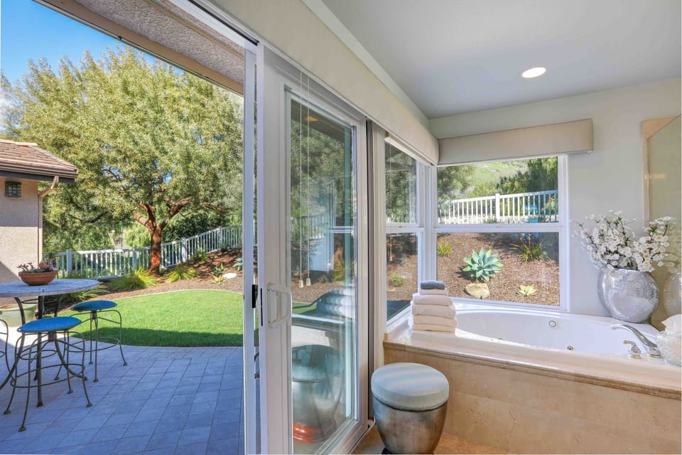 Master ensuite bathroom opens to the patio area for ocean breezes.