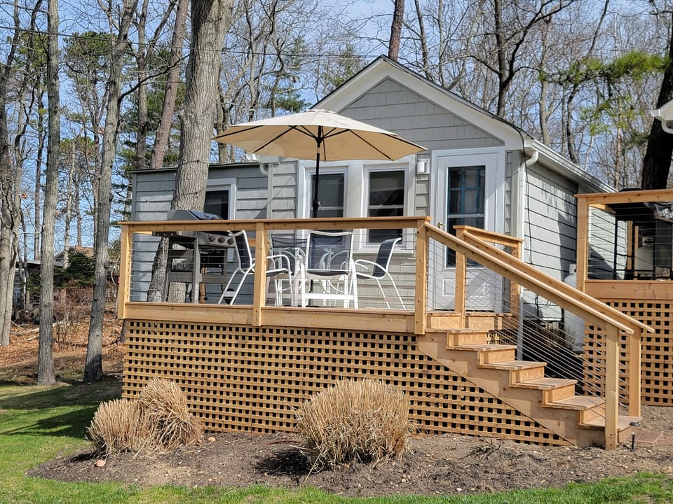 steps to two-bedroom cottage and deck with waterfront views