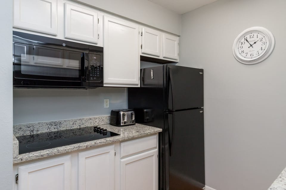 Your fully equipped kitchen awaits with granite counters, modern appliances, and everything needed for convenient meal prep during your stay.