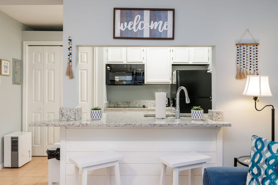 You'll love preparing meals in this bright, open kitchen with granite countertops, modern appliances, and welcoming touches throughout.