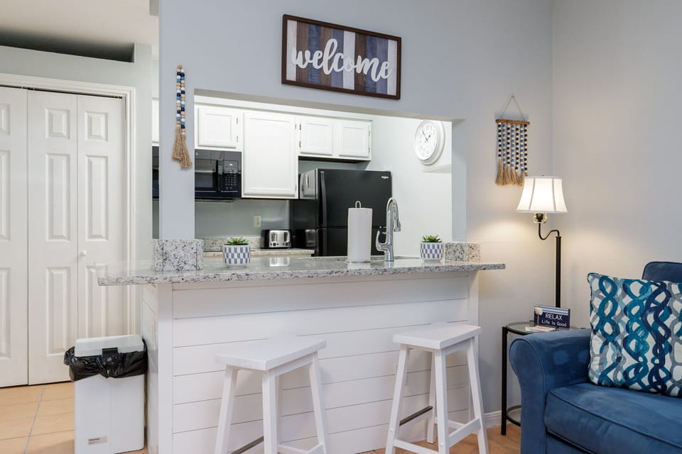 Your open kitchen flows seamlessly into the living space, perfect for morning coffee or casual meals at the breakfast bar.