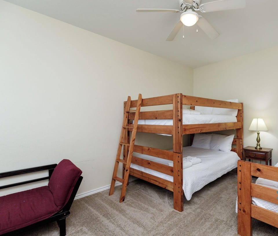 Sleep peacefully in this cozy bedroom with comfortable bunk beds and charming coastal decor that makes you feel right at home.