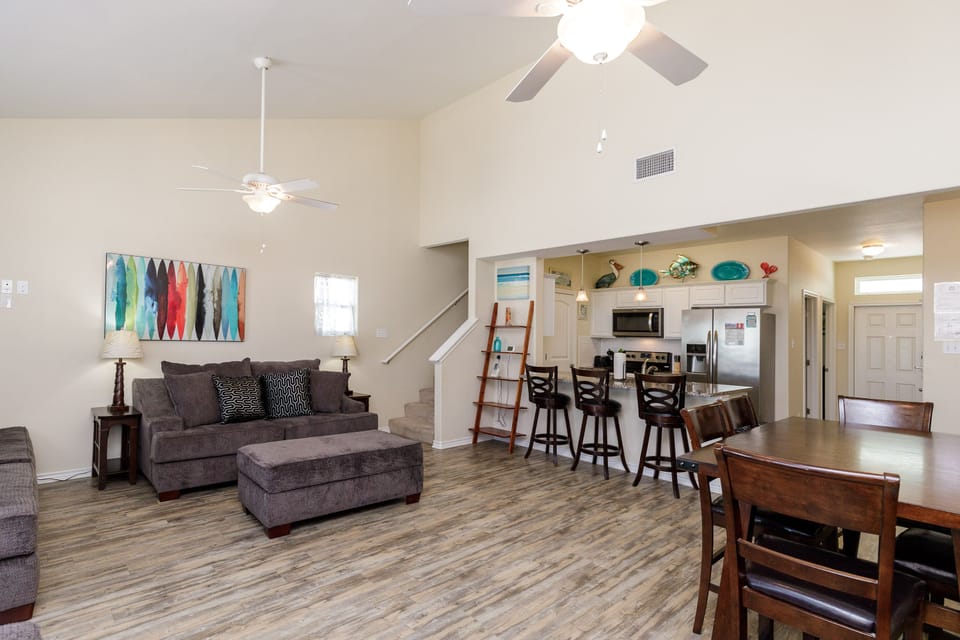 Relax in your spacious open-concept living area with comfortable seating, modern kitchen, and thoughtful touches that make you feel right at home.