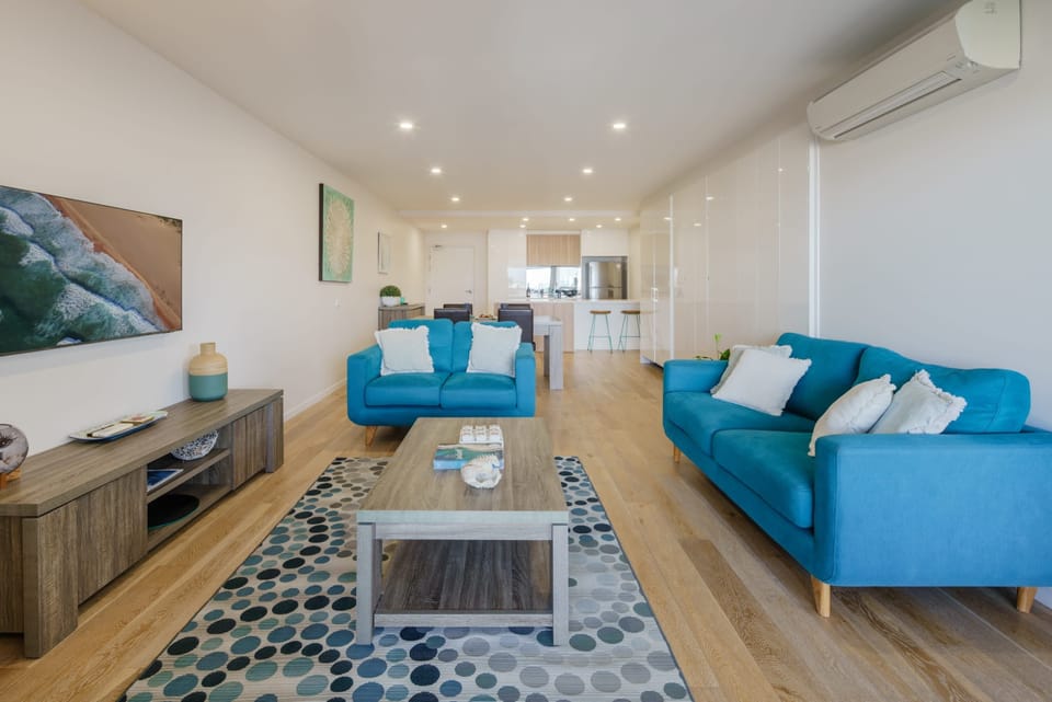 Catch your favourite TV show in the comfy living room.