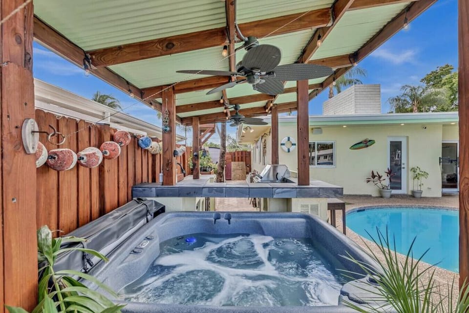 Hot tub is always hot and ready, strategically placed right next to the bar