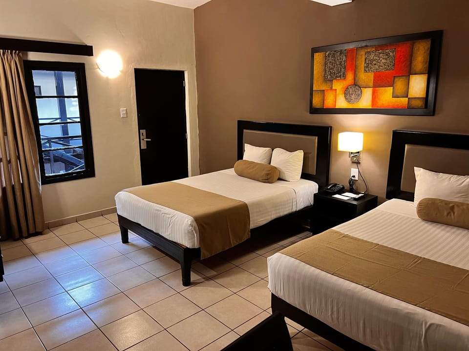 Standard Room, 2 Double Beds | Blackout drapes, iron/ironing board, free WiFi, bed sheets