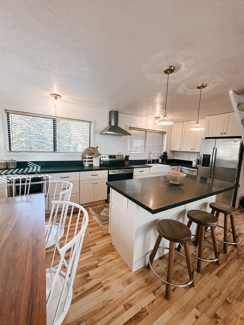 Brand new kitchen with trash drawer in the island and stainless appliances.