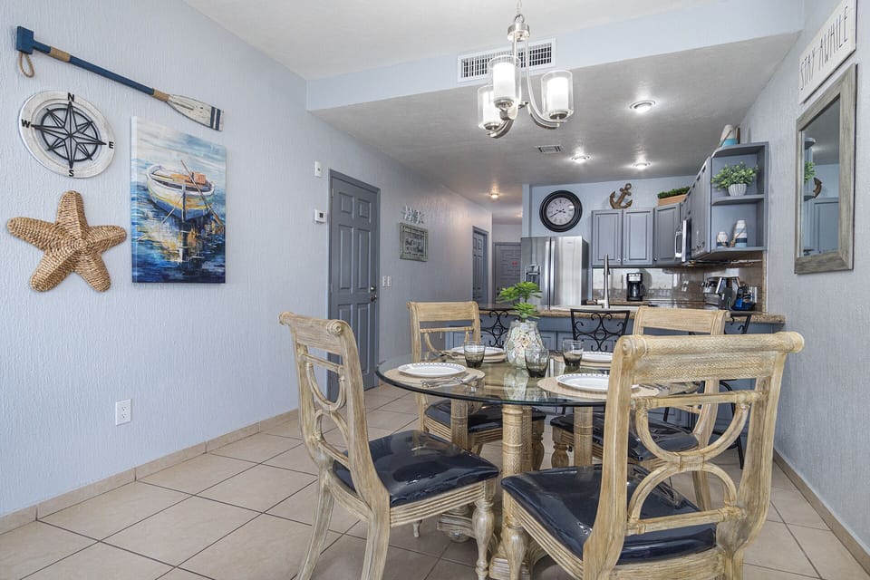 dining table is set neat the kitchen