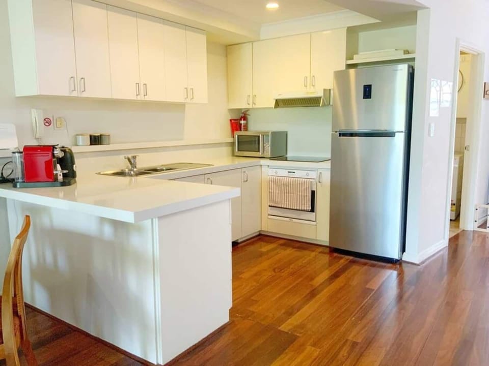 Fully Equipped kitchen with microwave.