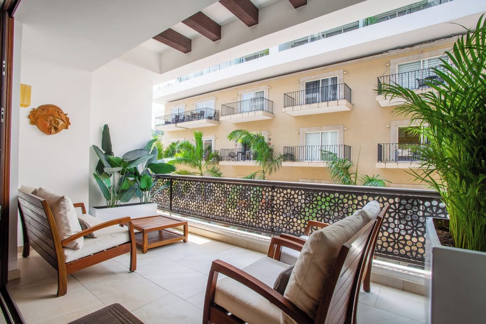 Spacious private balcony with outdoor furniture
