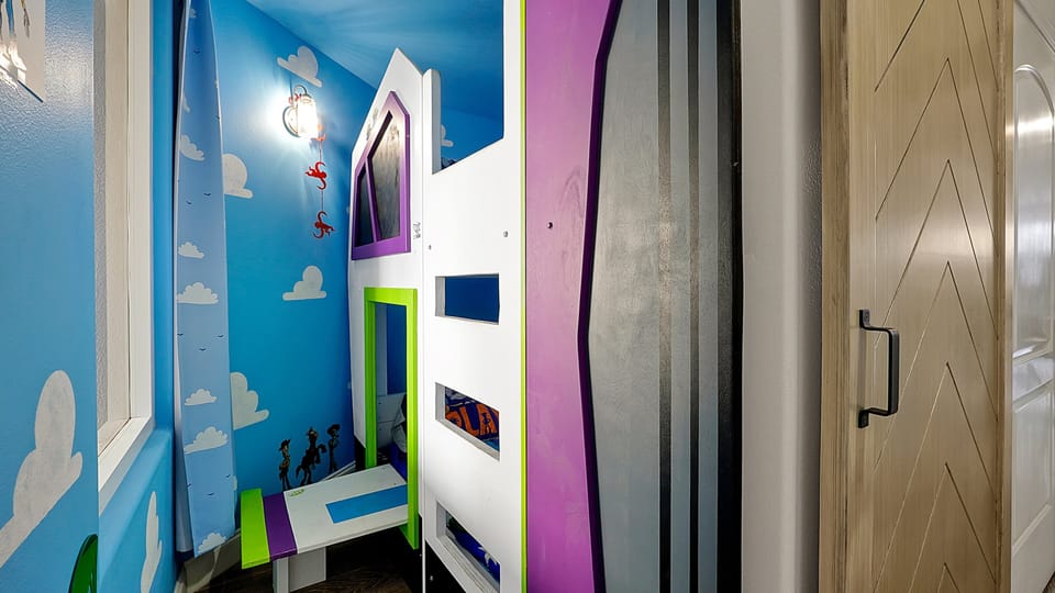 Themed "Andy's Room" with bunk beds and Smart TV's for both beds.
