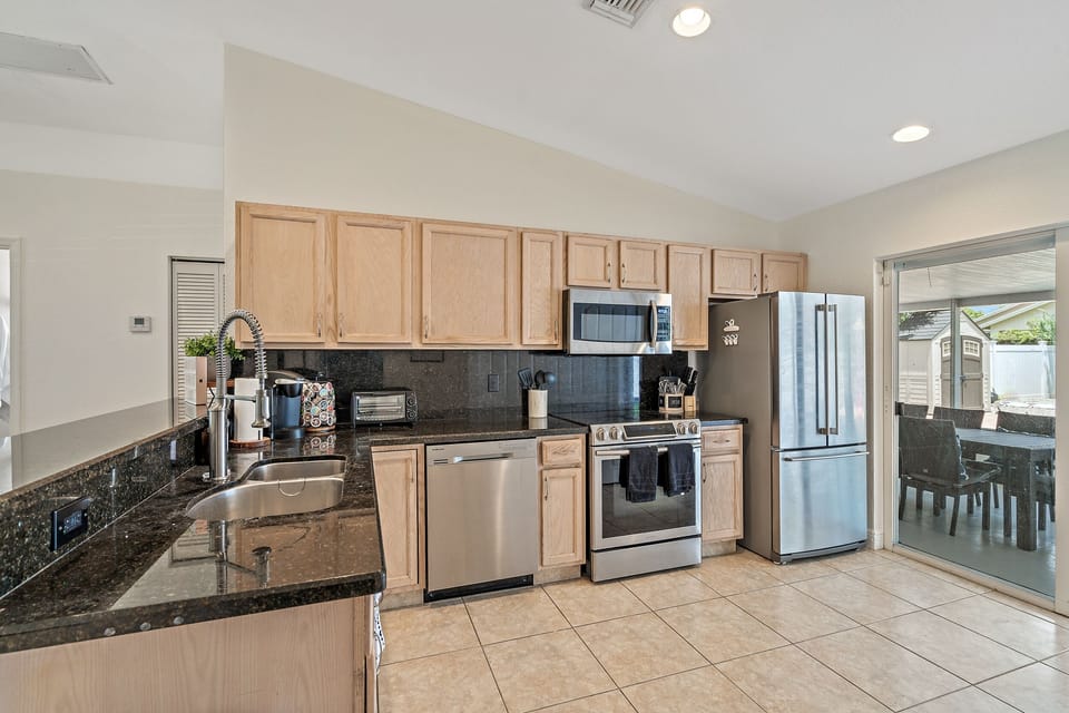 Fully stocked open concept kitchen.