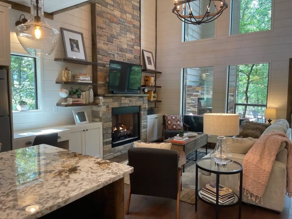 A spacious living room with gas-log fireplace, Roku tv to keep up with your favorite shows, and a desk area just in case you can't fully escape from work. 