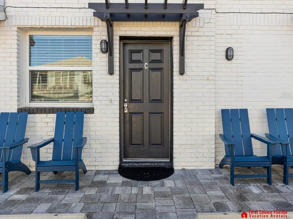 Charming front patio with cozy seating for relaxing outdoors