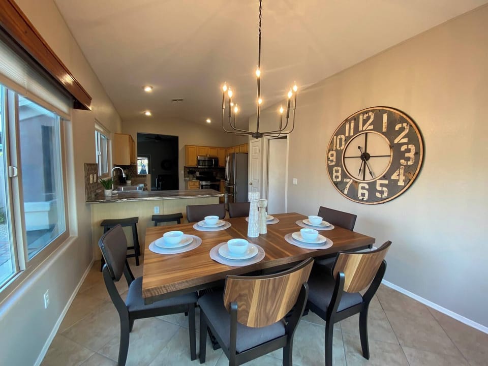 Dine in Style. There are 6 chairs and 2 stools facing the counter.