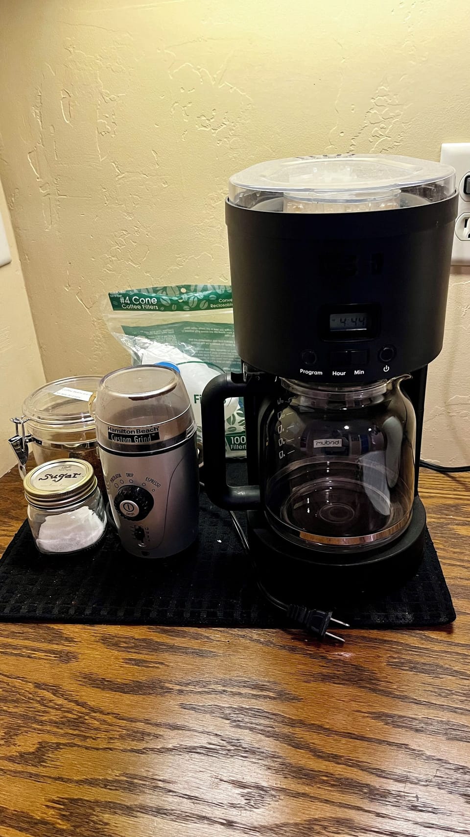 12-cup drip coffeemaker, filters and coffee grinder.  