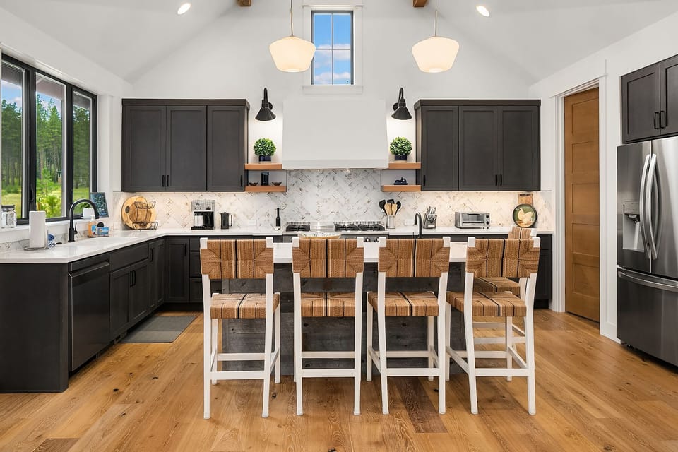 Freebird: - Fully stocked chef's kitchen with seating for 5 at the large island.