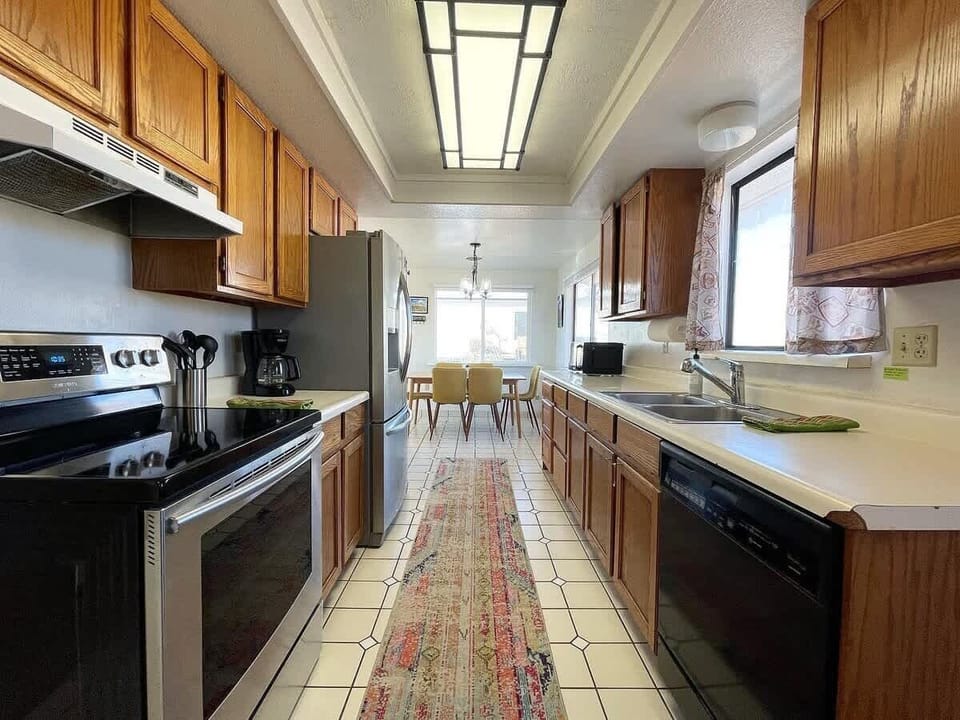 Imagine the aroma of your favorite dishes filling the air in as you cook in the upstairs kitchen. It’s fully stocked so you can easily prepare meals.