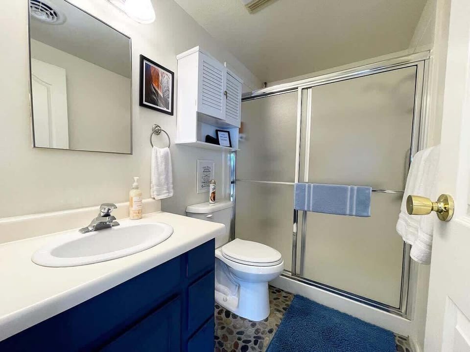 You’ll find a vanity, toilet, plenty of towels and a walk-in shower.