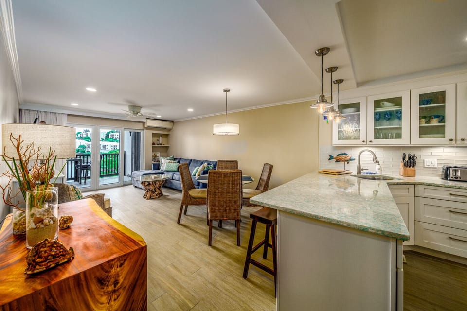The view of the living room and private balcony from the kitchen.
