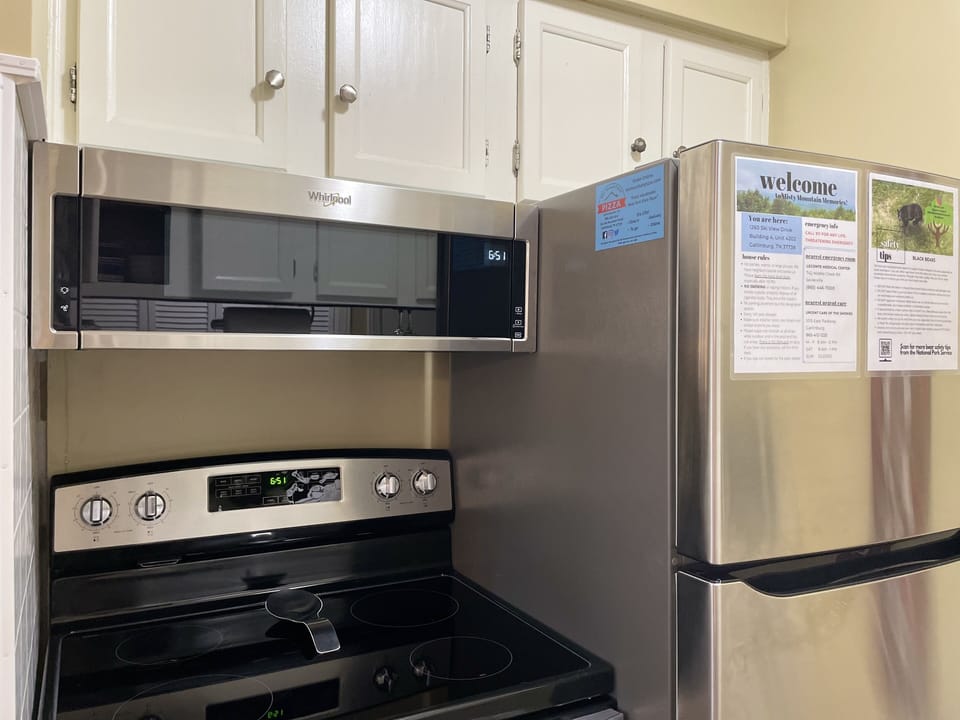 Fully-stocked kitchen with all-new stainless steel appliances and cookware.