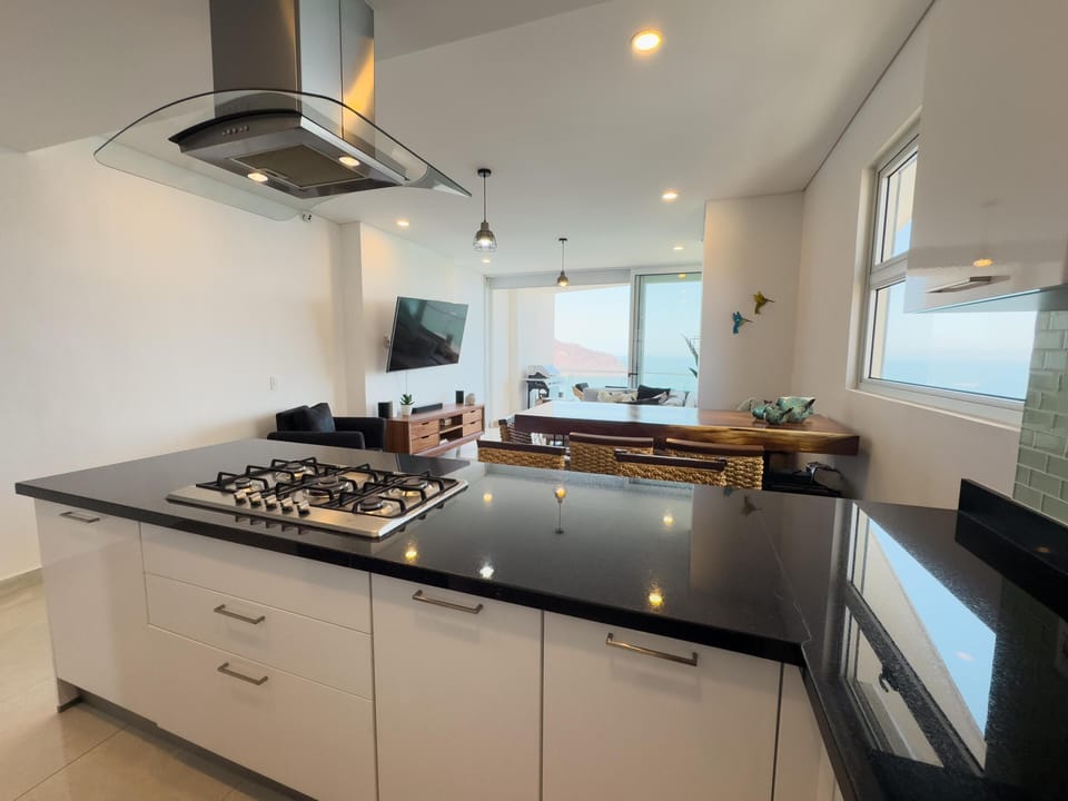Modern kitchen with sleek island and open living area views