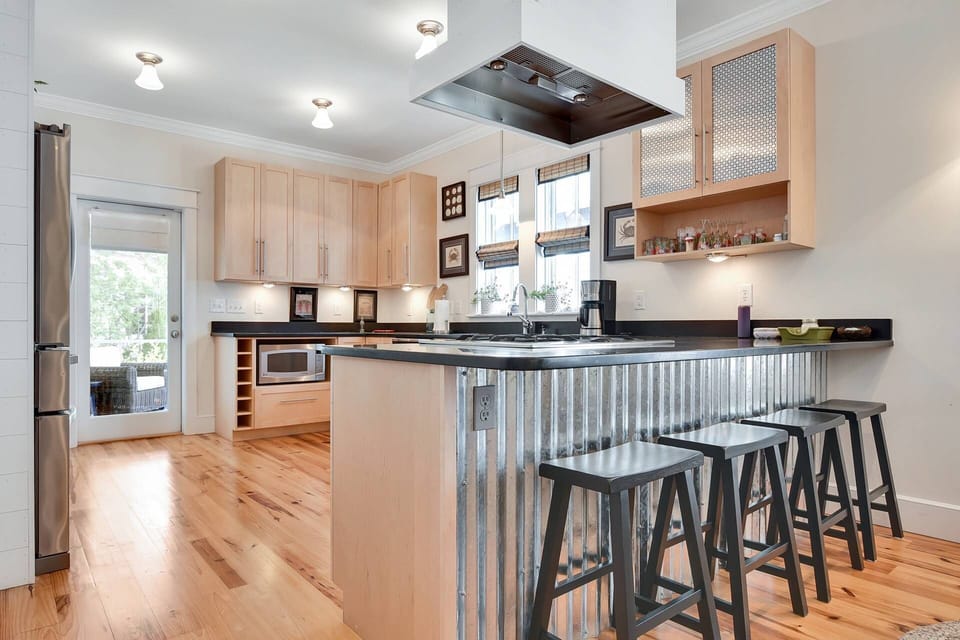 Modern kitchen with barstools to sit and chat while preparing meals