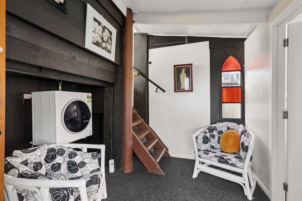 entry showing drier on left and loft stairs