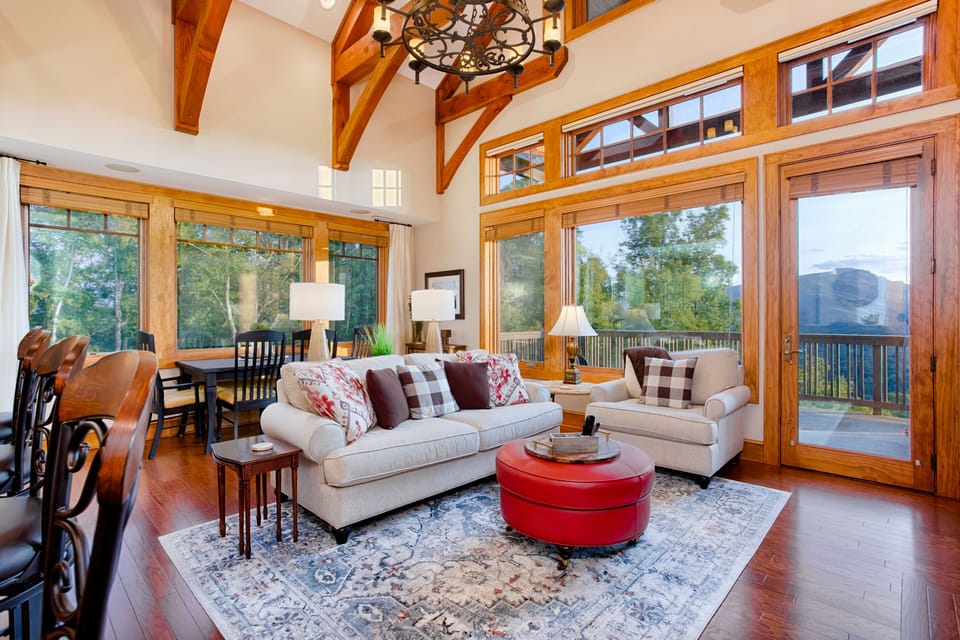 The den is a comfortable place to enjoy both the view and the fireplace.
