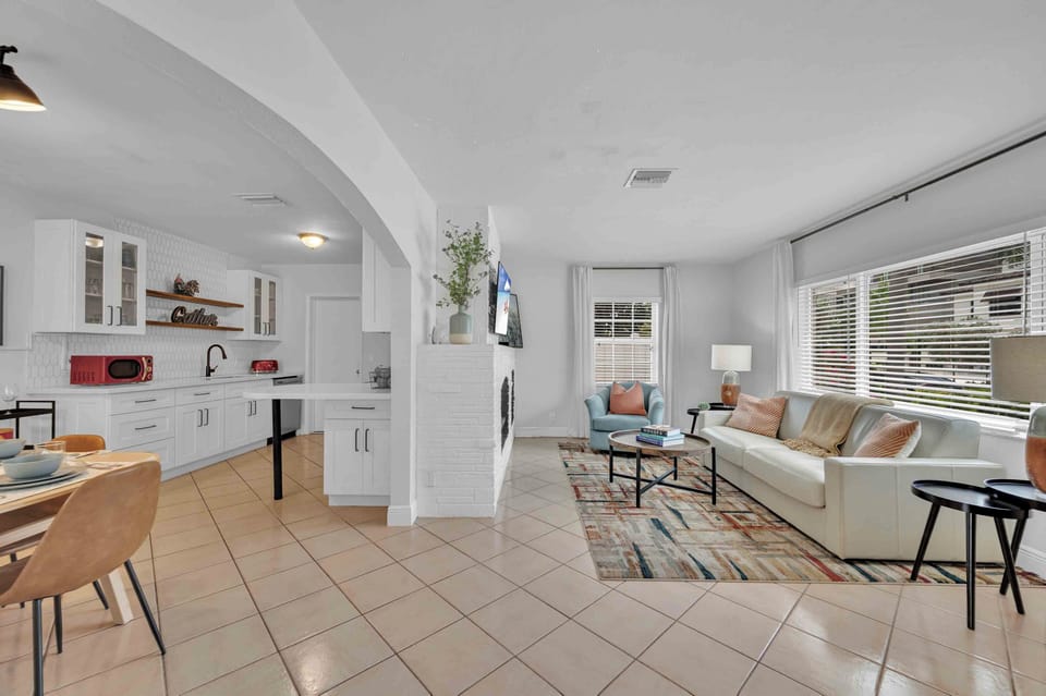 When you first enter the home, you are greeted by the living area, which is open to the rest of the home's common areas.