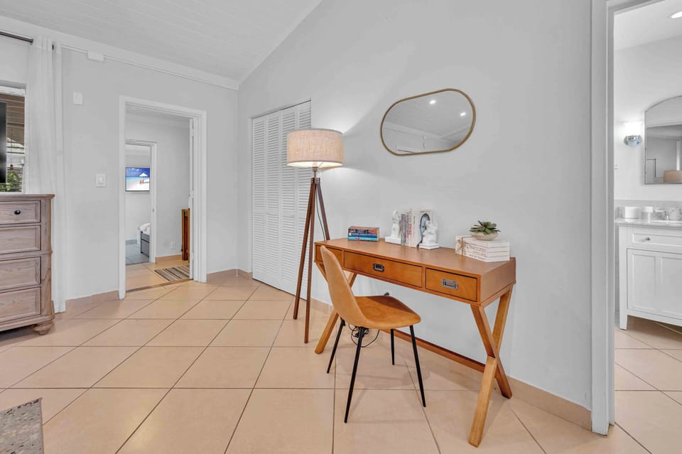 The private workspace in the primary bedroom is also great for those working remotely between trips to the beach!
