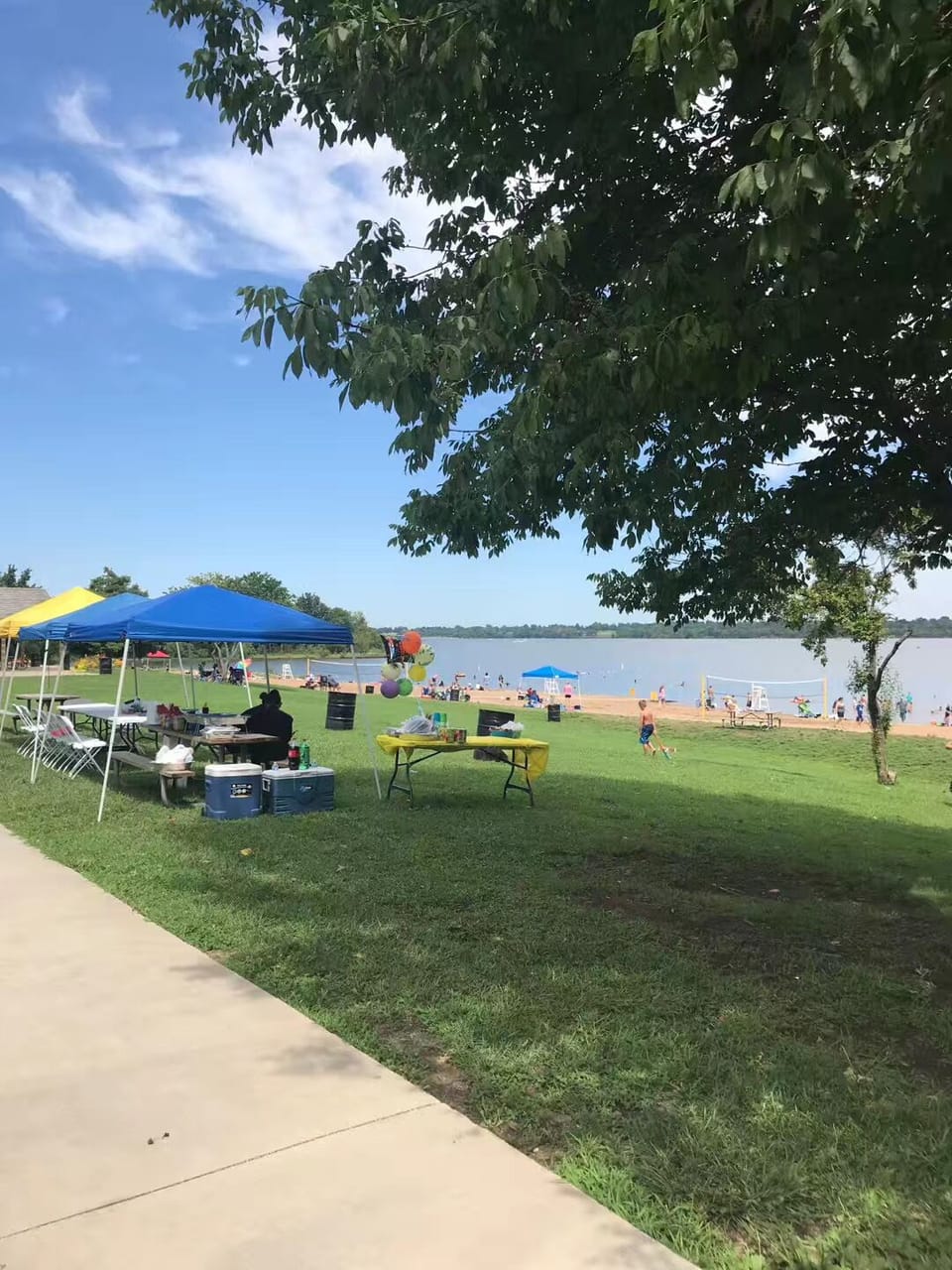 People are playing volleyball on the beach.