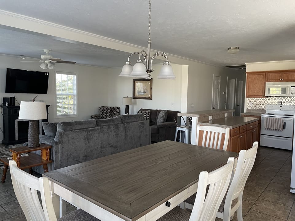 Large, open area living room, dining room, and kitchen. 