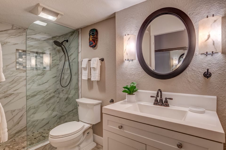 Remodeled bathroom with walk-in shower.