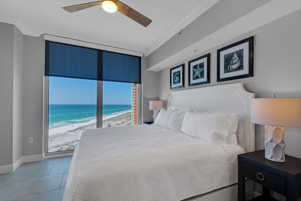 Guest bedroom with a fantastic view of the beach and blue ocean.