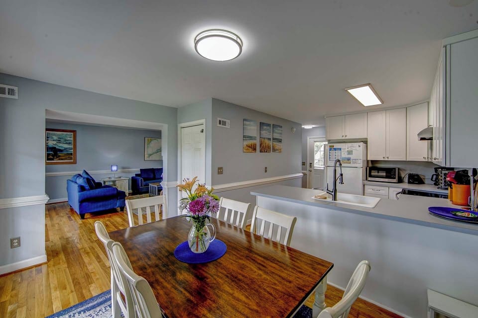 Gather around your spacious dining table for memorable meals, while the open kitchen layout keeps you connected to loved ones relaxing nearby.