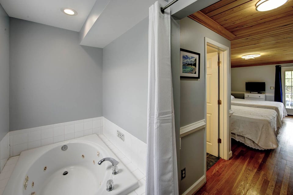 Soaking tub with separate stand up shower