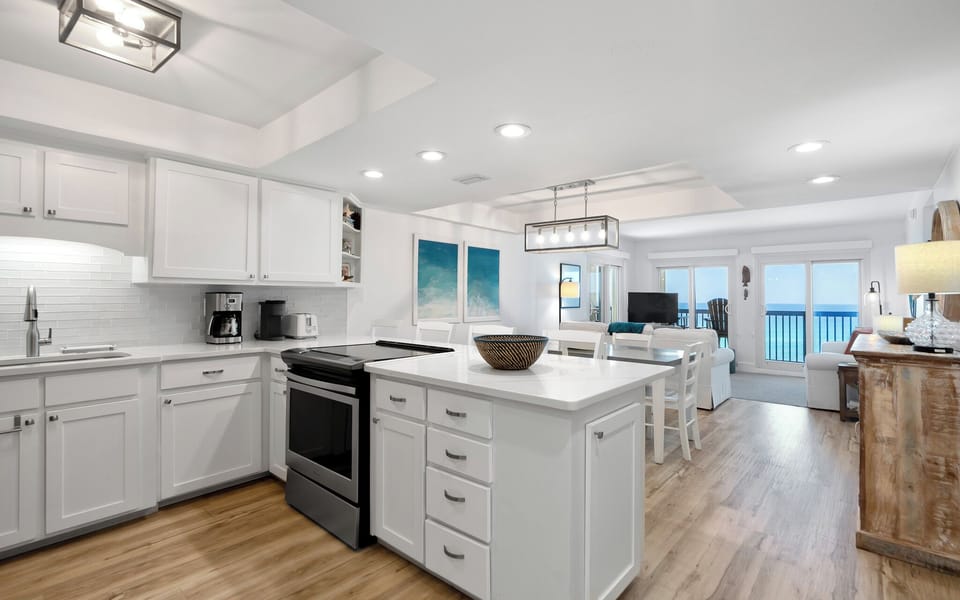 Your spacious kitchen flows seamlessly into the living area, where you'll love cooking with ocean views through the large windows.
