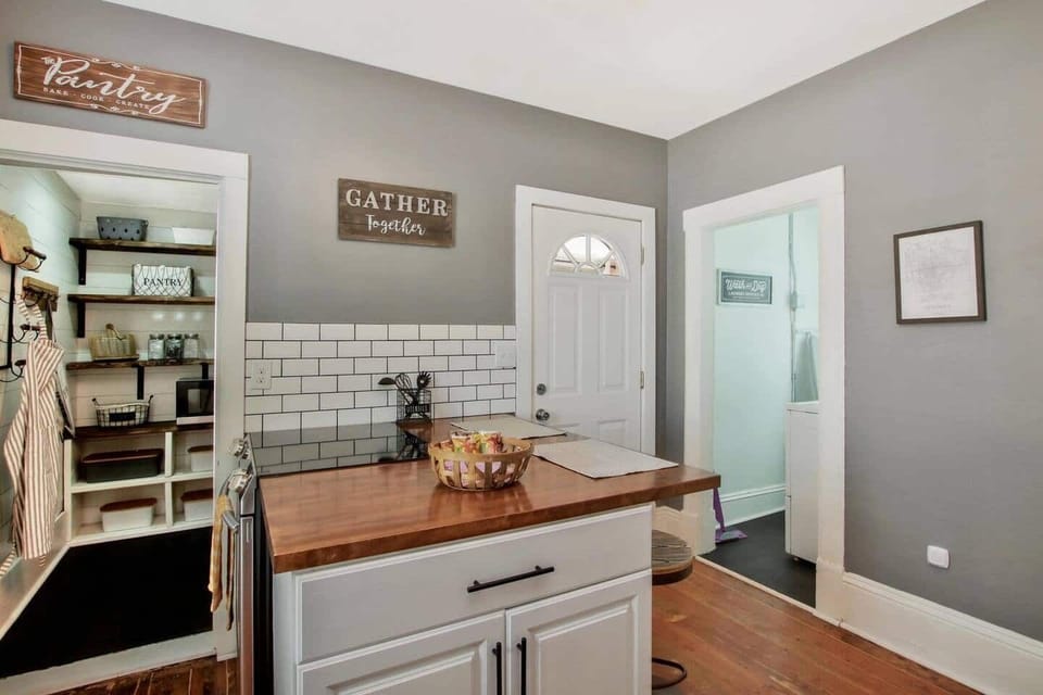 Cozy Kitchen Bar with Butcher Block Countertop and walk-in Pantry