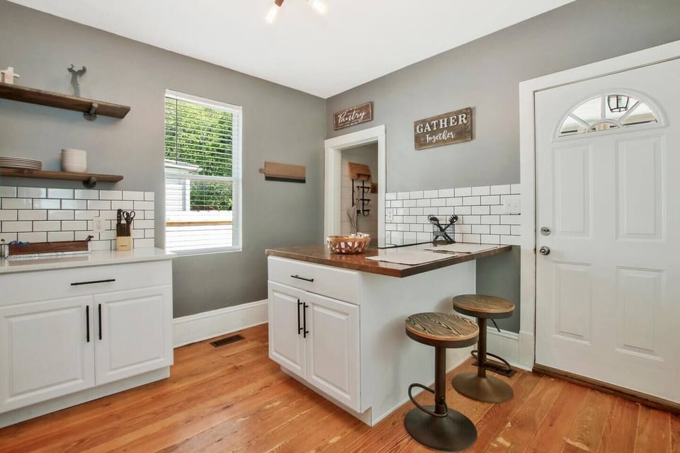 Updated Kitchen with Quartz countertops and large Stainless Steel Refrigerator, Slide in Stove and walk-in Pantry