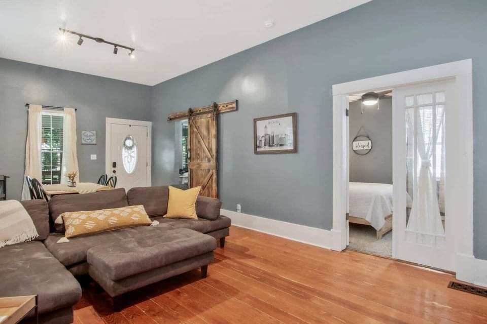 Large open living room and dining room with cozy couch