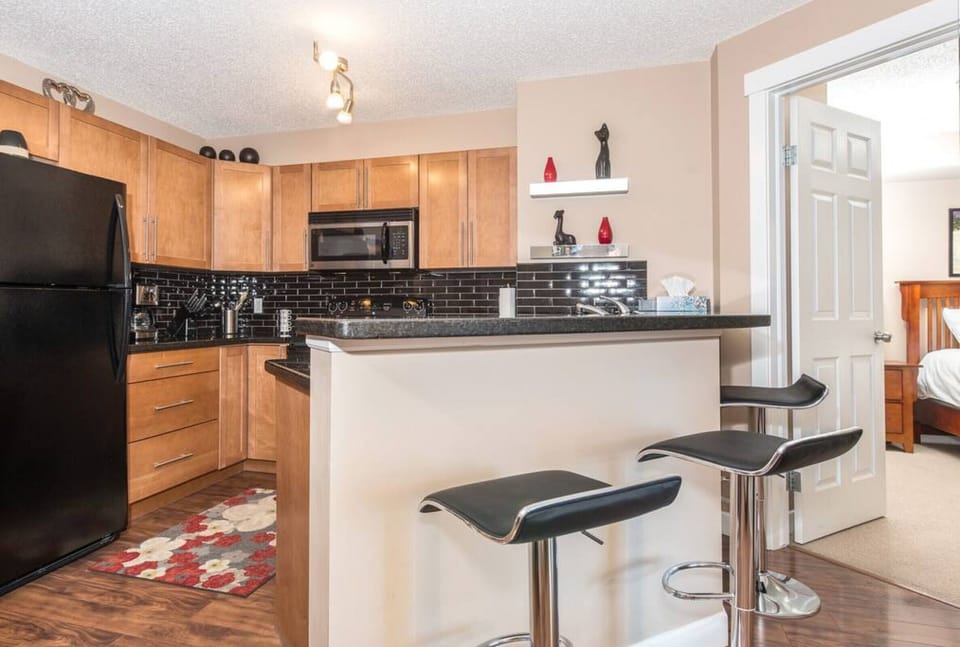 Full kitchen with a drip coffee machine, ground coffee, tea, sugar and basic condiments (ketchup, mustard and relish.)